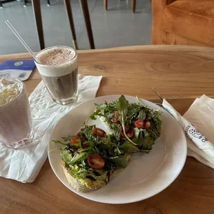Strawberry Frappe and Cold Brew with cold foam absolutely amazing along with delicious avocado toast and a berry croissant.