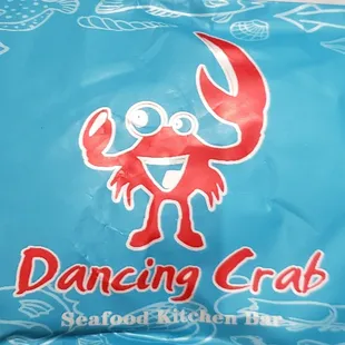 a blue bag with a red crab on it