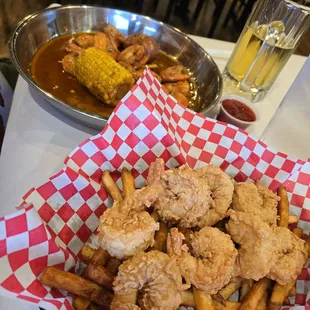 Fried shrimp, fries, corn and Cajun boiled shrimp