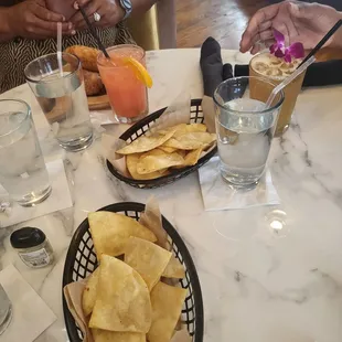 Fried Pita chips as a starter, Tequila Sunrise and Hennessey Margarita