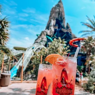 two drinks in front of a mountain
