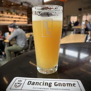 a glass of beer on a table