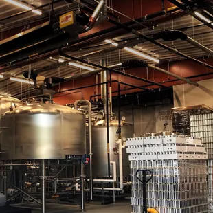 a large warehouse with a lot of tanks