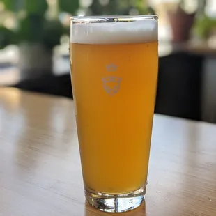 a glass of beer on a table