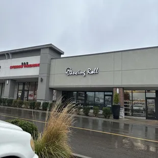 a white truck parked in front of a building
