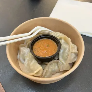 steamed chicken momos and tomato cilantro sauce