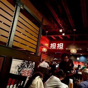 a group of people sitting in a restaurant