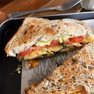 Breakfast sandwich, add spinach AND tomato, seeded whole wheat bread, eggs scrambled medium.