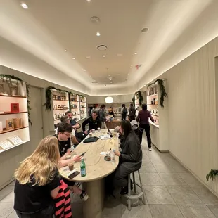 people sitting at a long table