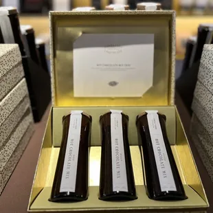 three bottles of chocolate