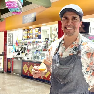 This is Dandino, owner and chef of Dandino&apos;s Arepas cafe who came our with a fresh batch of home made hot sauce to share with us!