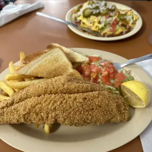 Fish plate with French fries salad. Yummy. Beef enchiladas