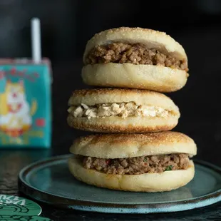 a stack of three sandwiches on a plate