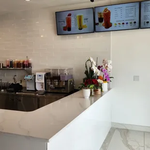 a coffee shop counter and menus