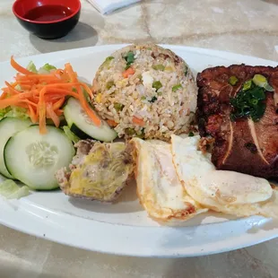 Porkchop rice plate, sub fried rice and sub extra egg for shredded pork.