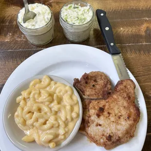 Pork chop w/sides of mac n cheese, potato salad, coleslaw