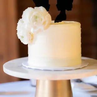 a wedding cake with silhouettes of a couple