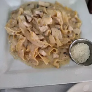 Chicken Alfredo with side of parmesan cheese