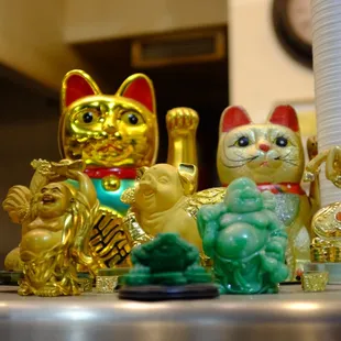 a variety of gold and green figurines
