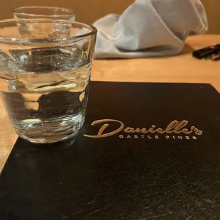 a glass of water and napkin