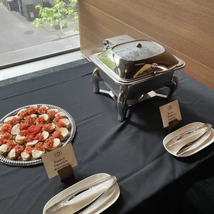 a buffet table with a variety of food items