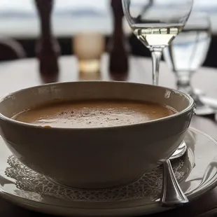 a bowl of soup and a glass of water