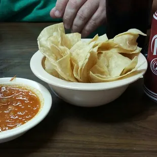Complimentary chips and salsa with an enchilada plate.