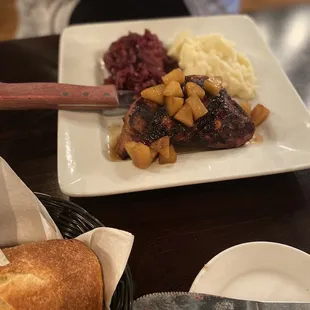 Grilled Pork Chop with garlic mashed potatoes and braised Sauerkraut