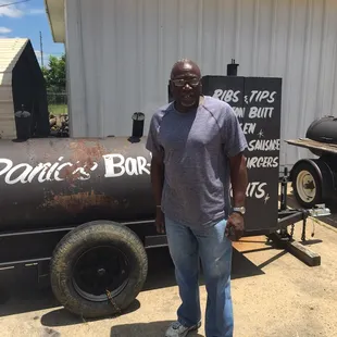 Daniel out checking the smoker