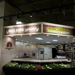 a display of fresh produce in a grocery store