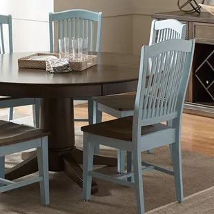 Dining table and chairs from John Thomas Select Custom Furniture at Daniels'Homeport Coastal Furnishings on the Outer Banks.