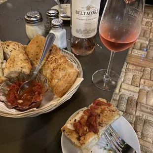 a plate of food and a glass of wine