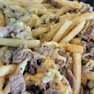 Carne asada fries loaded a little green sauce