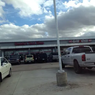 From parking lot, front of shop in plaza