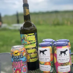 a bottle of wine and cans of beer