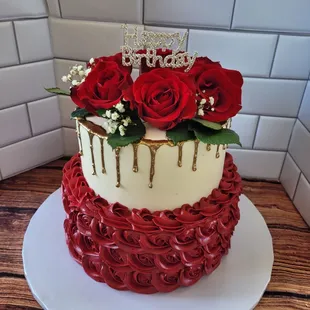 a cake with red roses