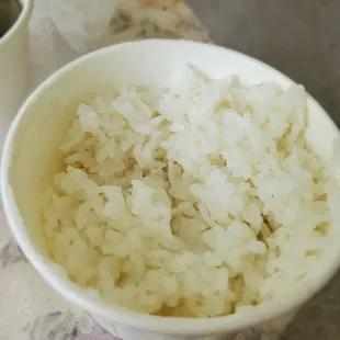 This is how it came with delivery...Looks like they recycle the rice. It is yellowish. I throw it away!