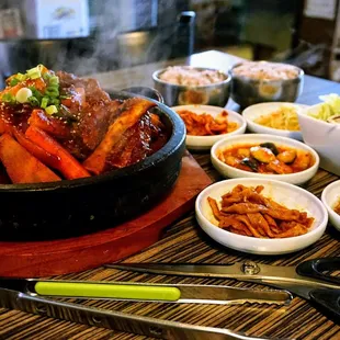 Spicy Galbi Jjim: rice cake, onion, sweet pumpkin, green pepper, carrot w/ spicy sauce &amp; beef rib ($59.50).