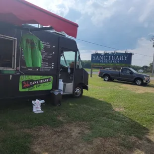 a food truck parked in a field