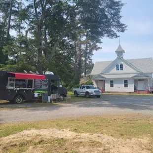 a food truck parked in front of a house