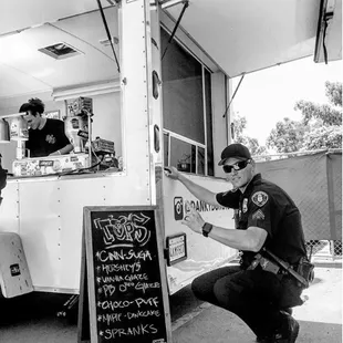 a man working on a food truck