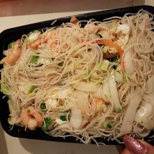 a plate of noodles and shrimp