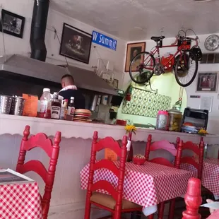 Owner hard at work on our order. Limited seating but smells great