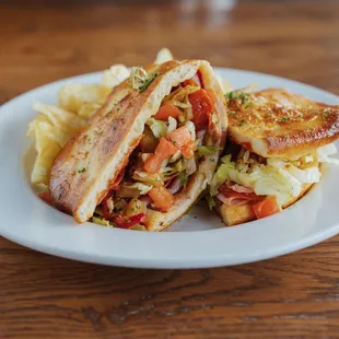 a sandwich and chips on a plate
