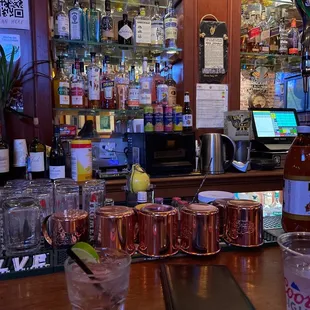 a bar with a variety of drinks