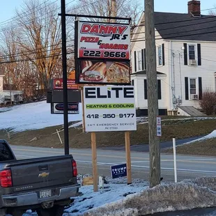 a truck parked in front of a restaurant