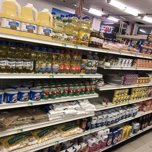 a shelf full of oils and other products