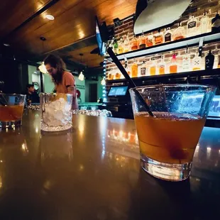 a woman sitting at a bar