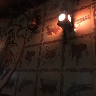 the wallpaper and ceiling