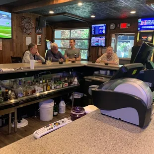 customers sitting at the bar